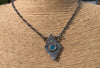 Organic triangle  pendant with an Apatite gemstone