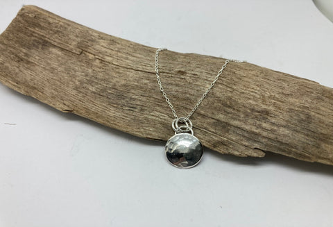 Textured silver disc pendant
