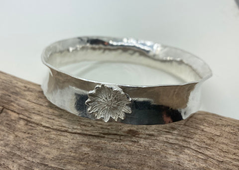 Anticlastic  silver bangle with a Poppy head