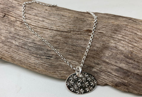 Silver embossed pendants