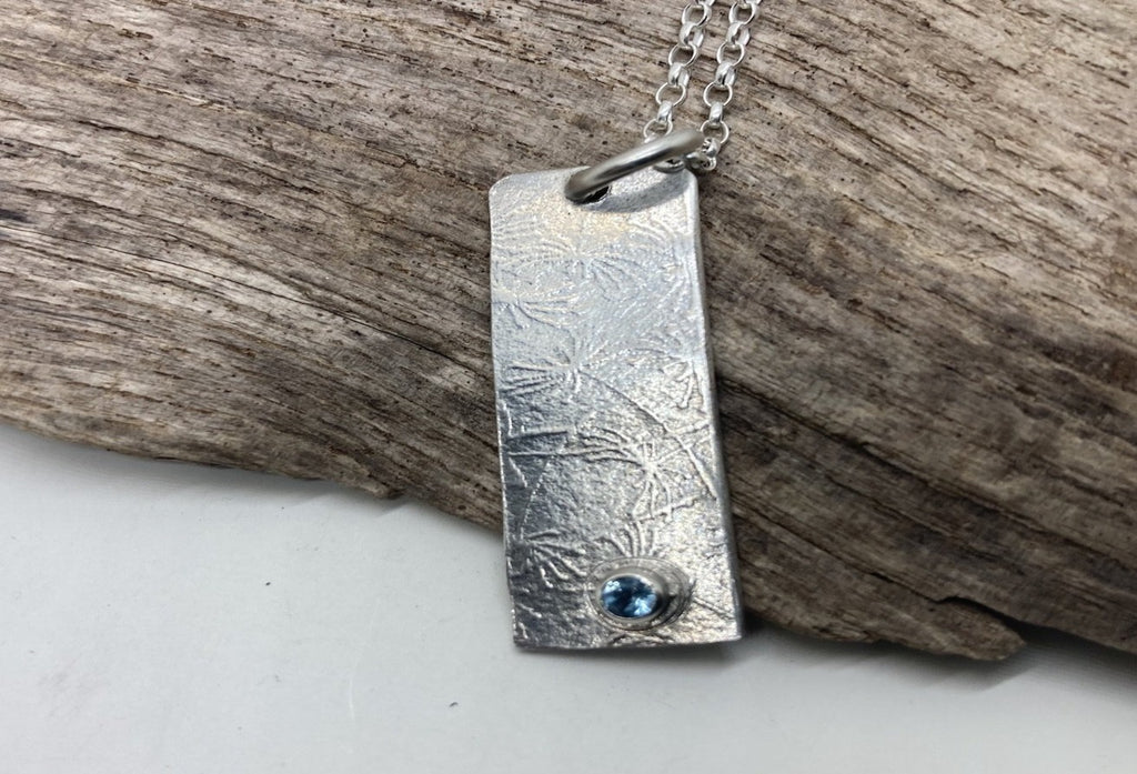 Topaz and silver pendant